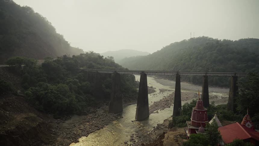 A view of a river with a large bridge over it