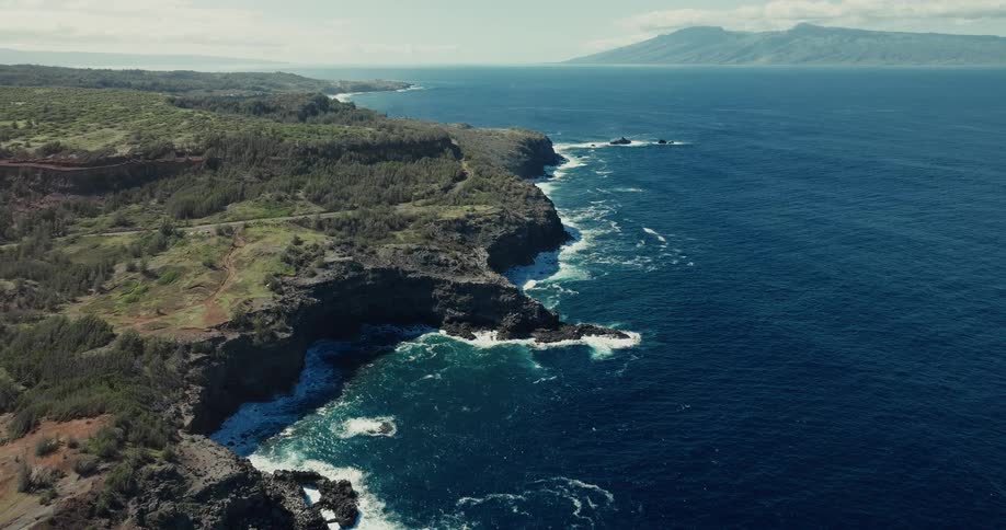 Aerial view of the rocky shoreline and the sea waves