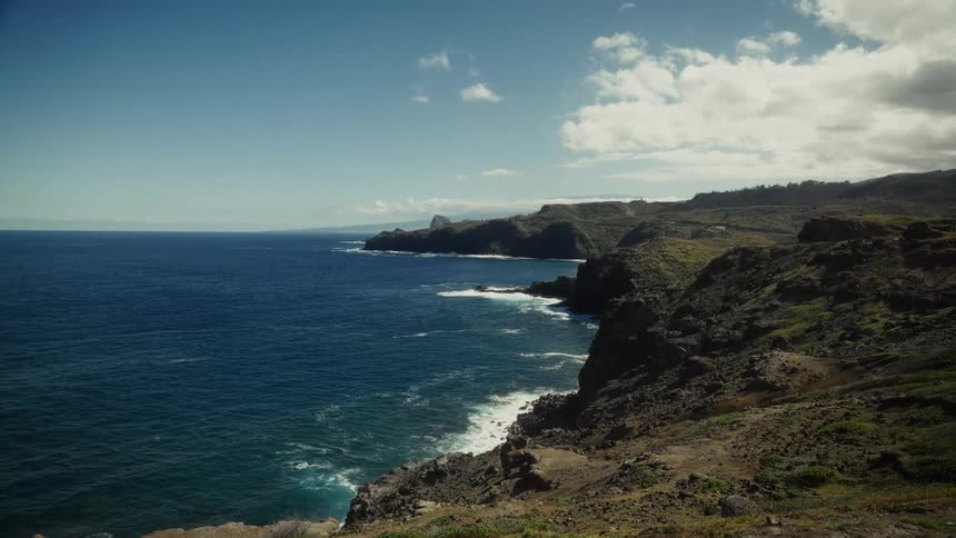 The waves hit the shore of the island