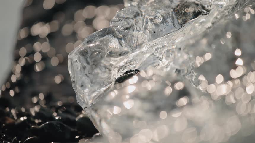 A close up view of some ice on a beach