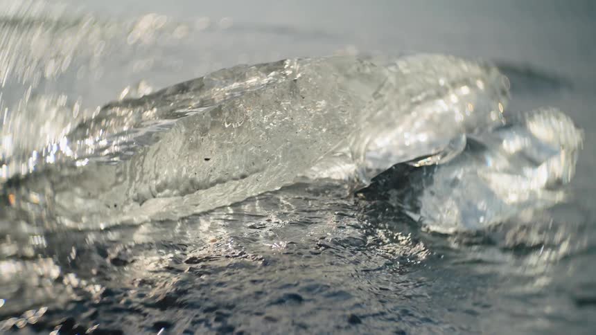Sun shining on ice melting along the coast