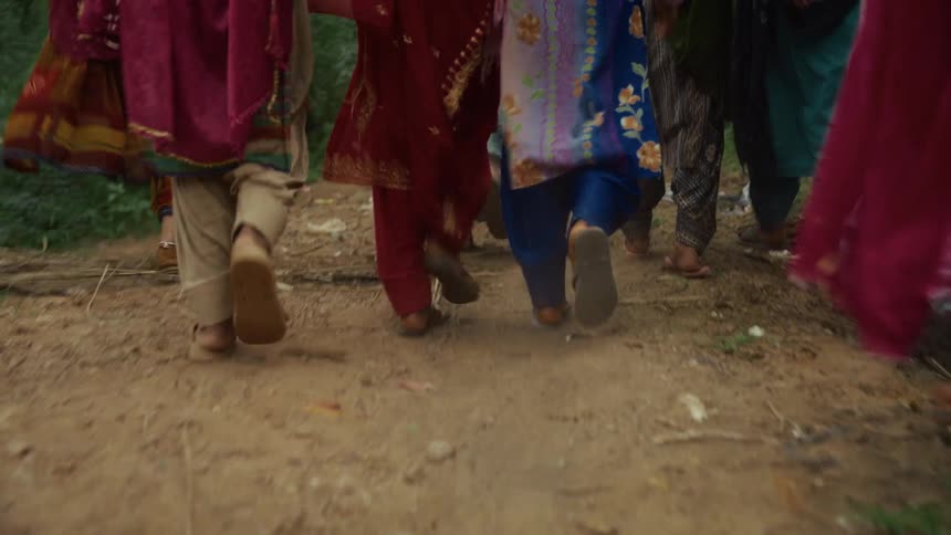 A group of people walking outdoors