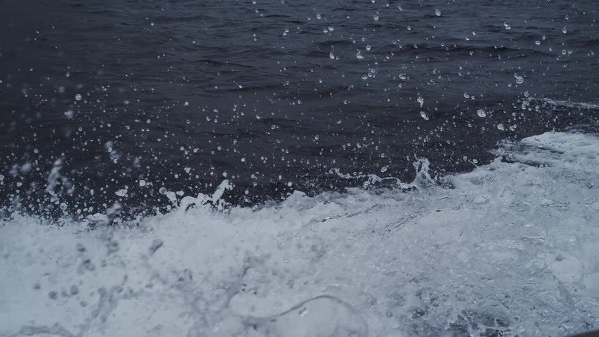 Water splashing in motion over ocean surface