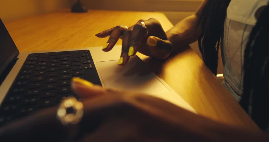 A woman using a laptop in a room