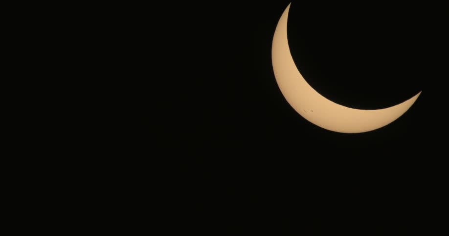 Sun being eclipsed by moon