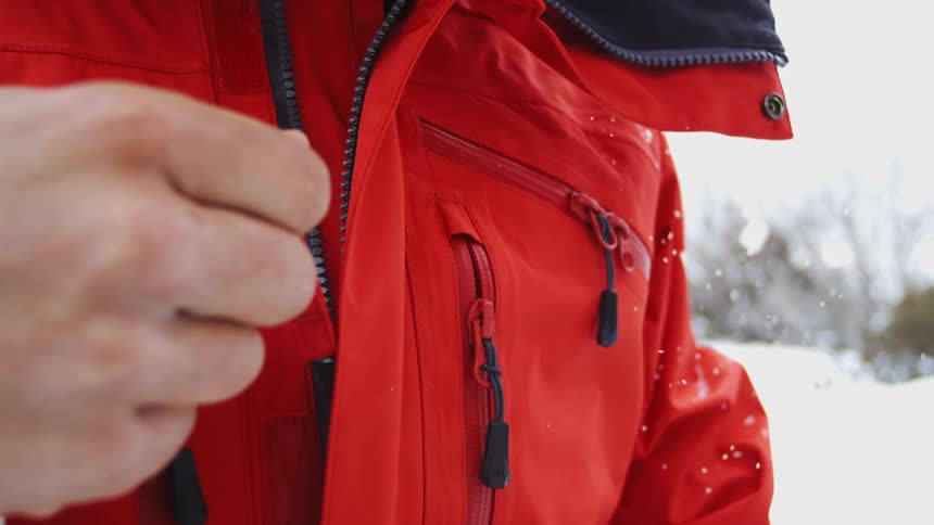 A person standing outdoors in the snow