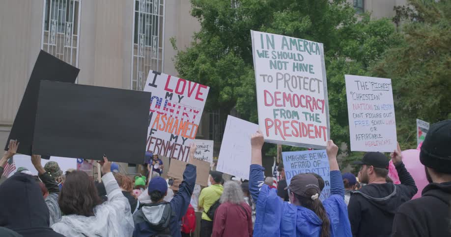 A view of people holding up signs