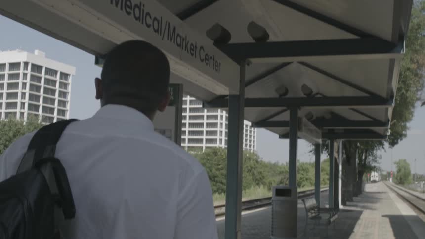 A man walks past a train
