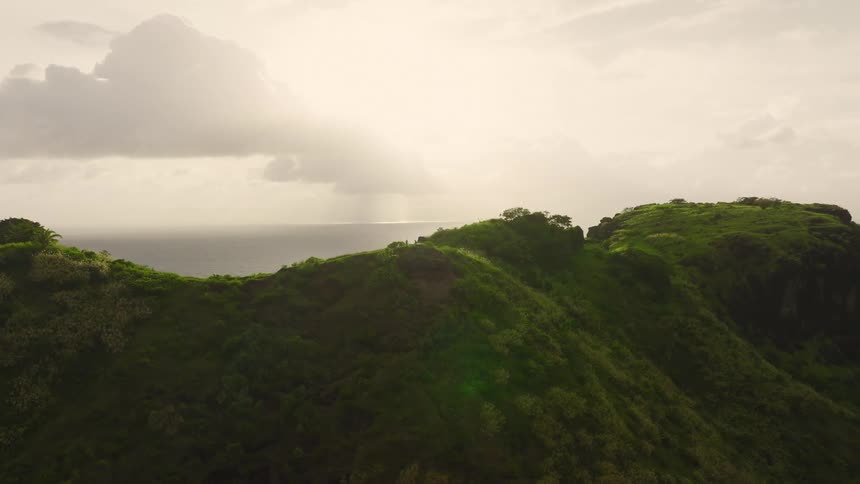 Ridge of an elevation on a coastal area with the ocean on the background outdoors during day time
