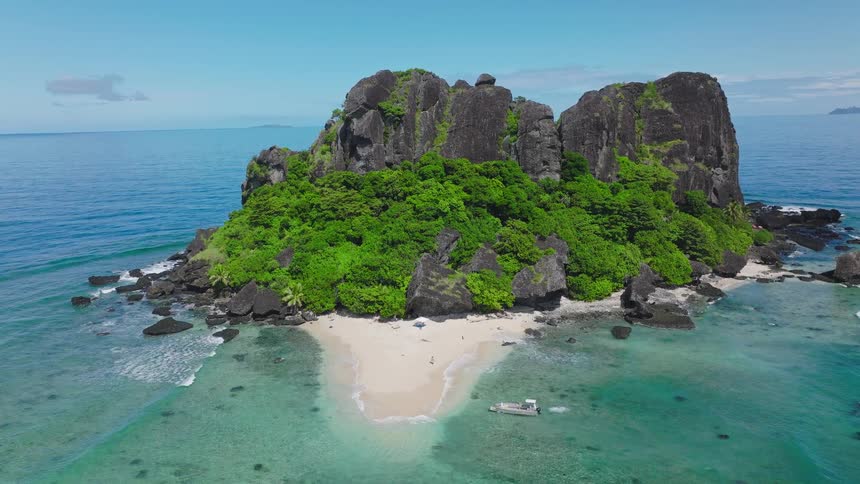 The boat travels to the sand of the small island
