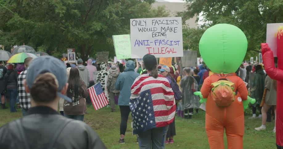 Sign with phrase only fascists would make being antifascist illegal held during park protest