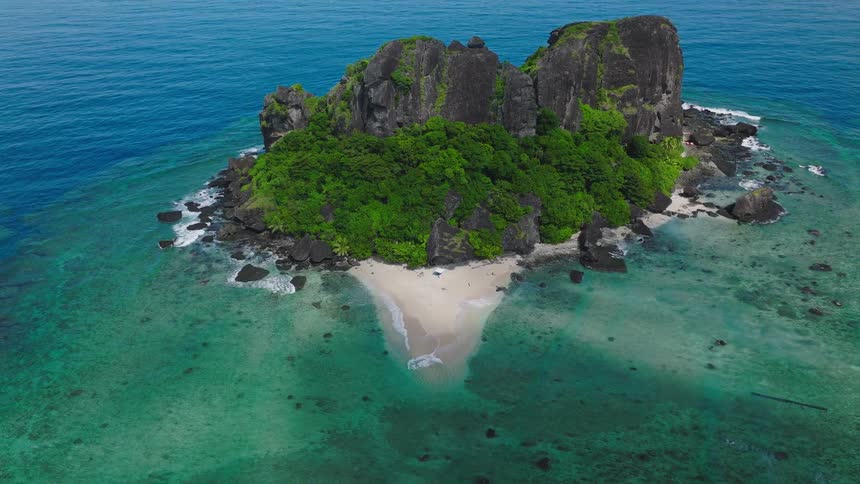 A tropical island located in the middle of the ocean