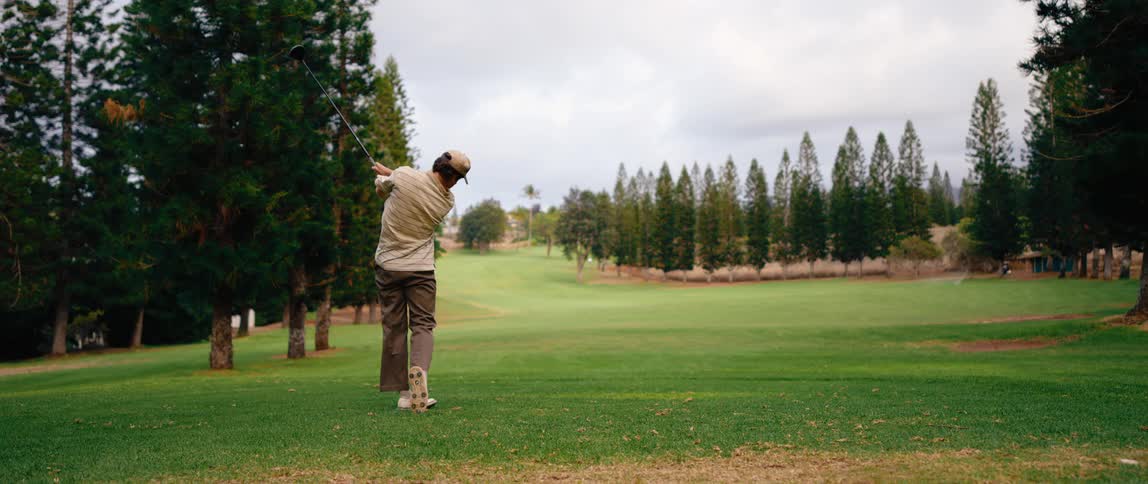 A man playing golf on the golf course during the day
