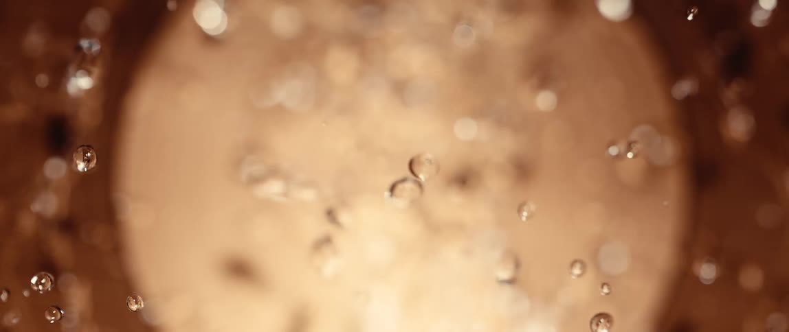 Water moves around and vibrates on the speaker