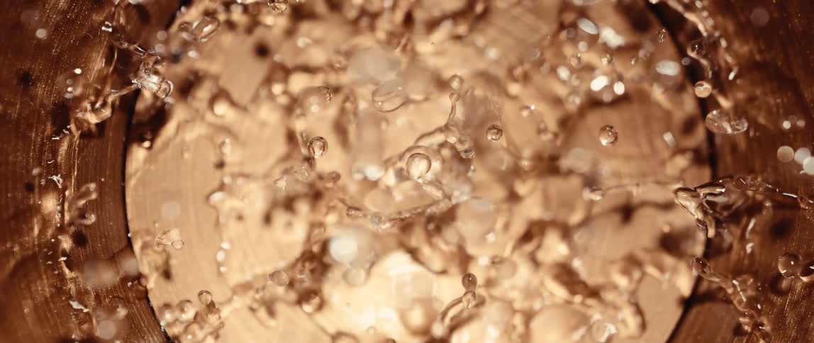 Bubbles and water droplets on a golden surface