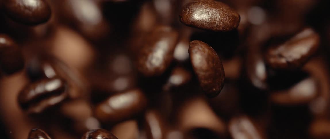 A group of coffee beans that are being ground up