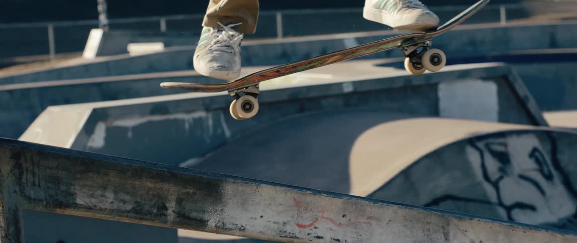 A person skateboarding outdoors on a sunny day