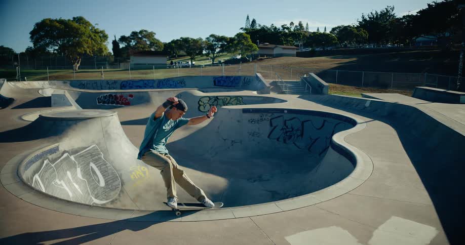 A man is riding a skateboard at a skate park