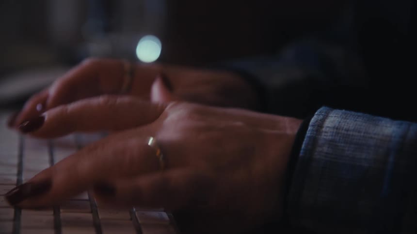 A woman working on a computer in an office