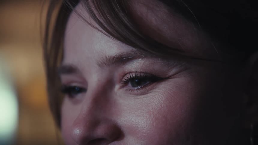 Woman puts on glasses