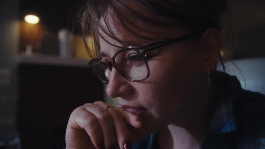 A woman working on a computer in an office
