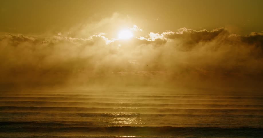 A view of clouds at the edge of the ocean