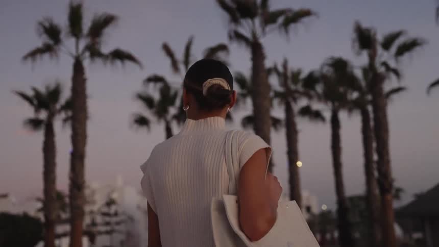 A woman modeling clothes outdoors