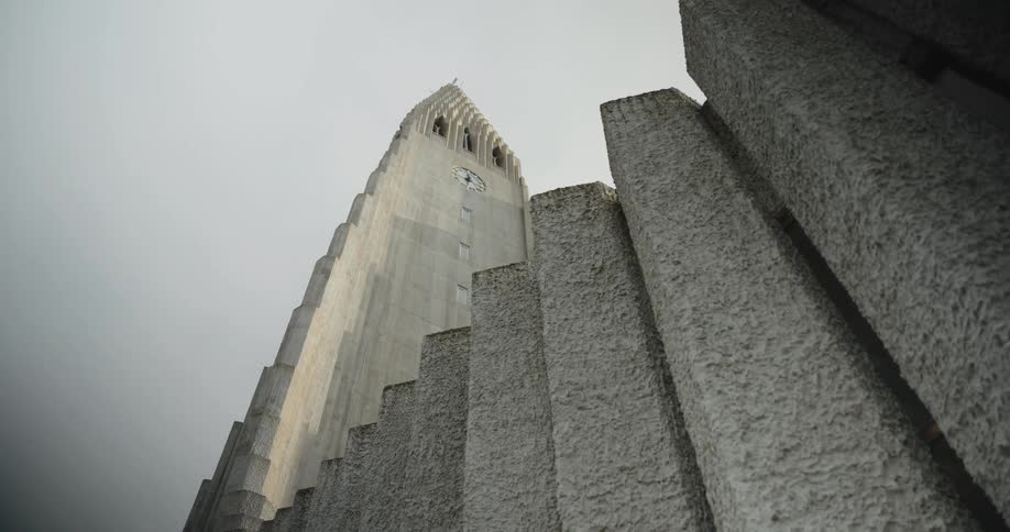 Concrete tower with pronounced vertical lines viewed from a low angle