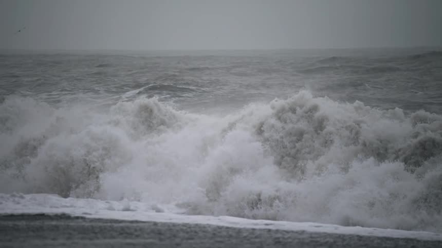 Strong ocean waves barreling onto the shoreline