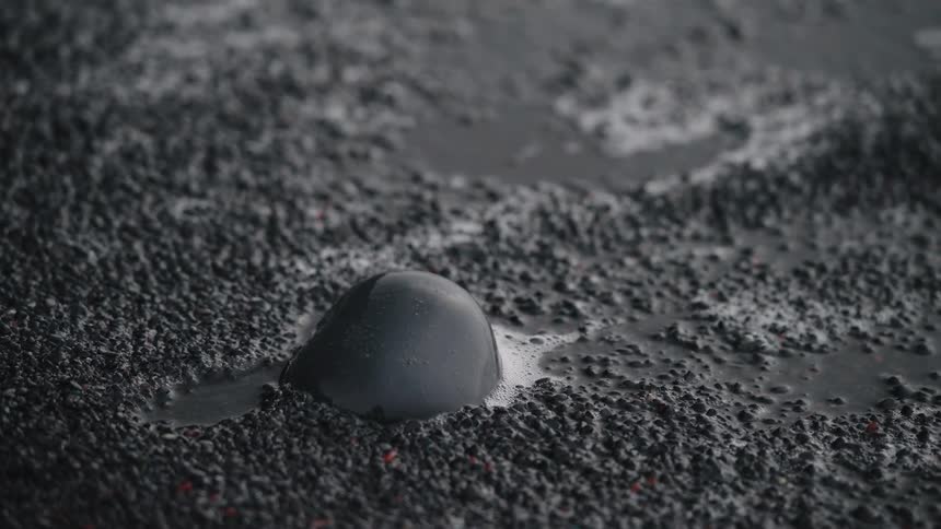 A sand or gravel like substance is bubbling and moving into liquid