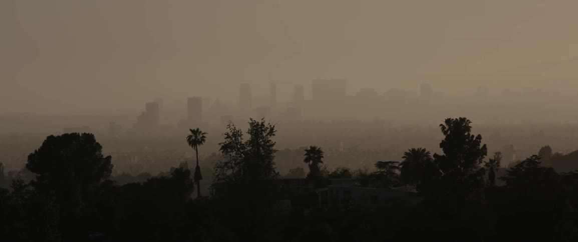 Heavy fog is covering the city at dawn