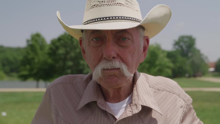Man with decorated white hat