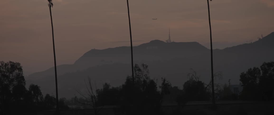 The hills are covered with fog at dawn