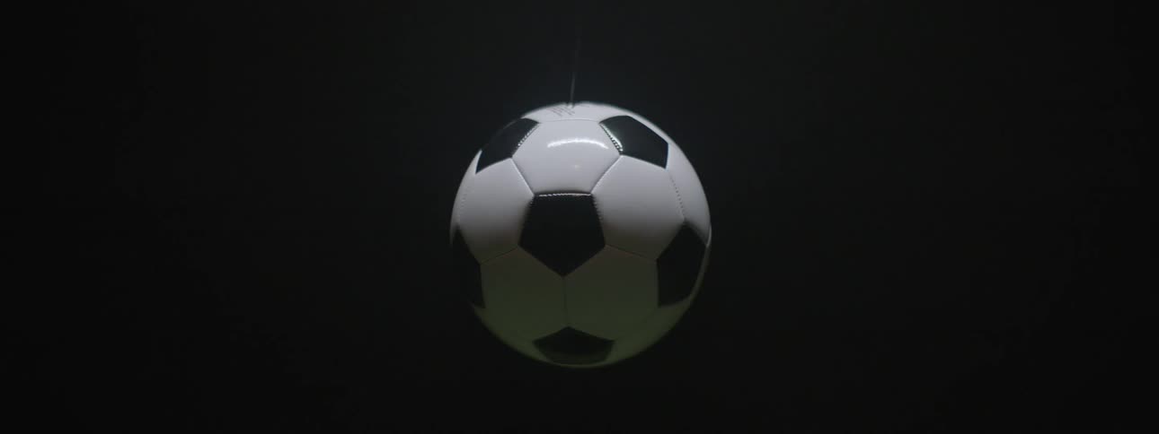 The camera spins to make a stationary soccer ball appear to rotate