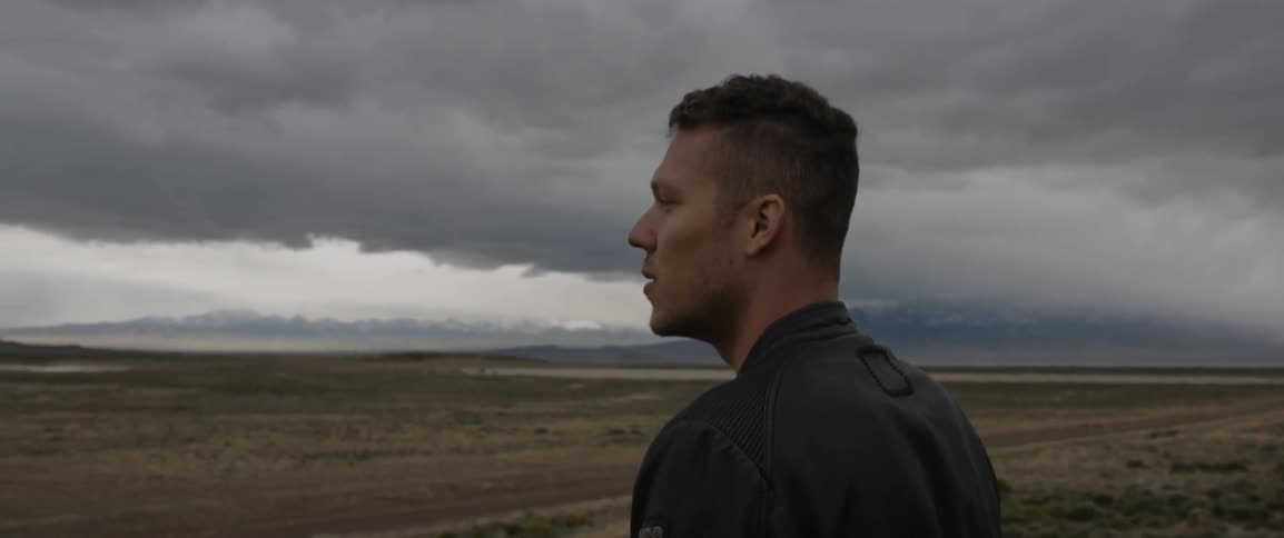 Man standing and enjoying the surroundings in mountain wilderness
