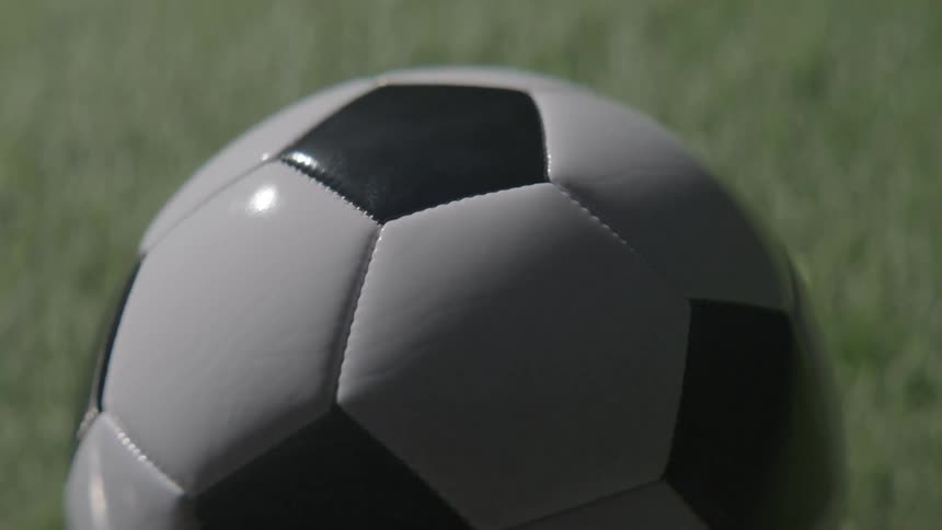 A soccer ball sitting on the grass