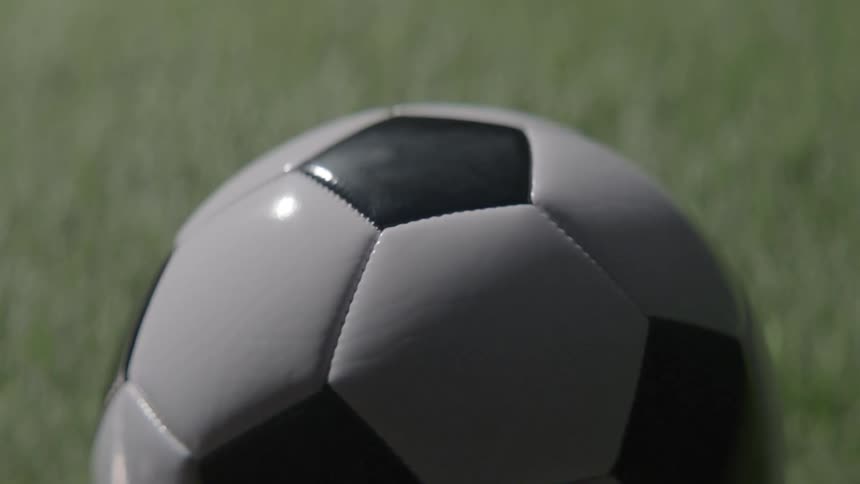 A soccer balll on a field outdoors during day time