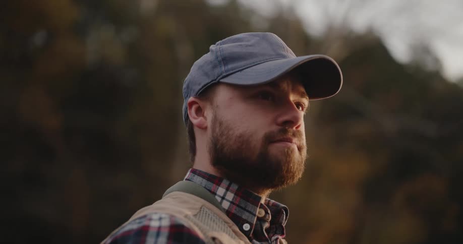 Close up portrait of a young man standing outdoors during daytime