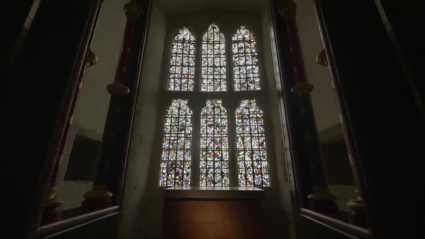 Sunlight shines through ornate windows