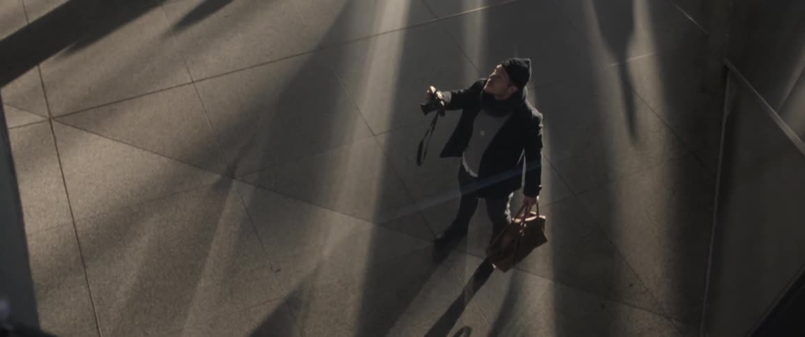 A man takes a picture with his camera