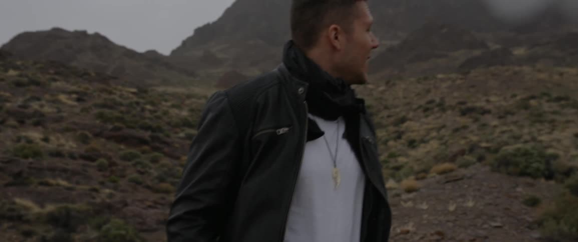 Man walks over a rocky terrain