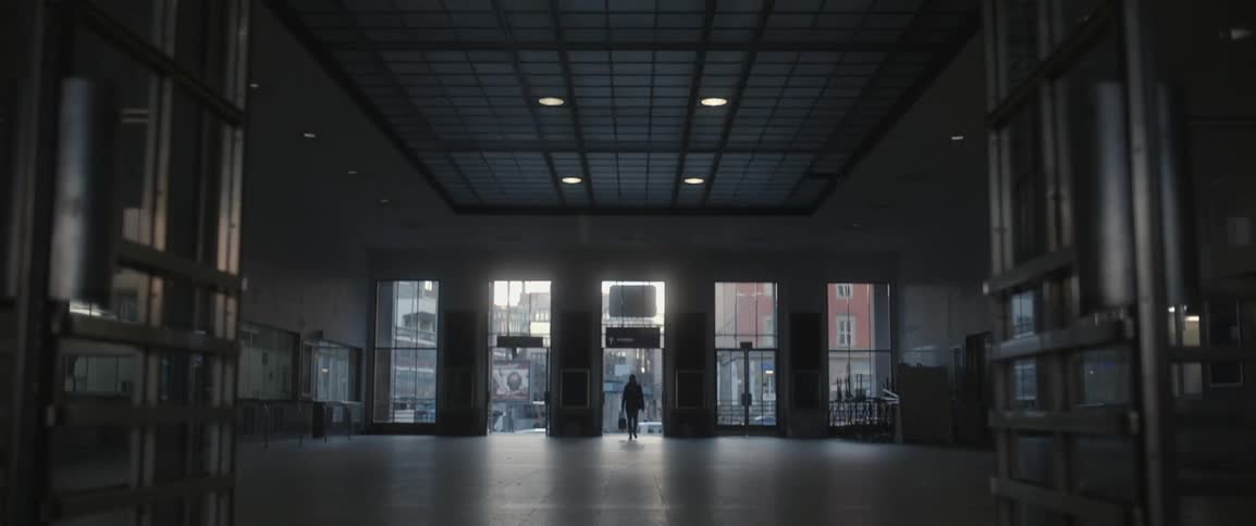 A person enters a spacious city building