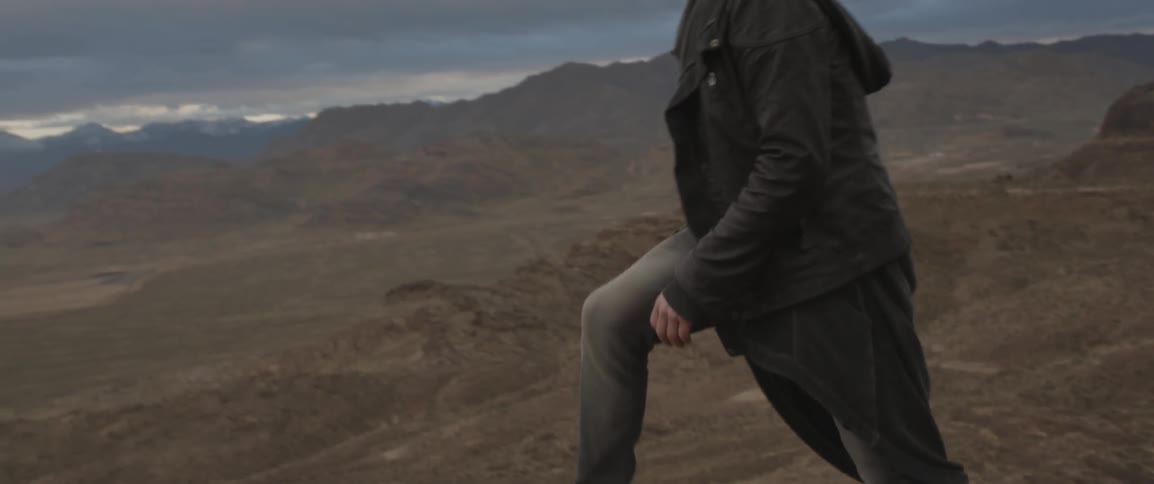 A man climbs on the top of a mountain