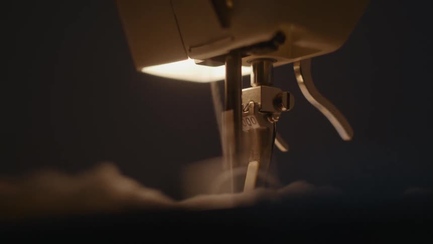 A sewing machine stitching