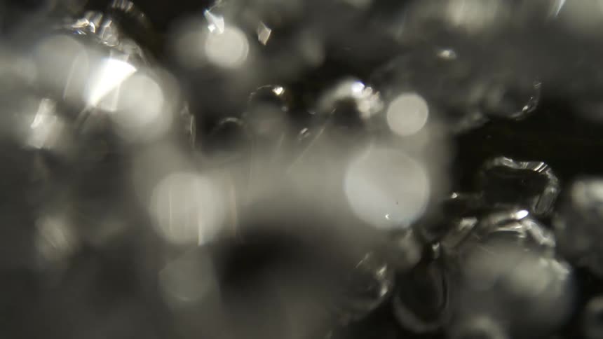 Close up of bubbles rising from water being boiled