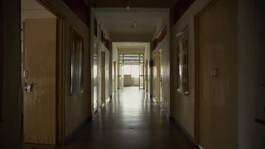 Sunlight shines into a long corridor in a commercial building