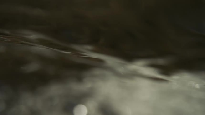 A close up of water flowing in a river