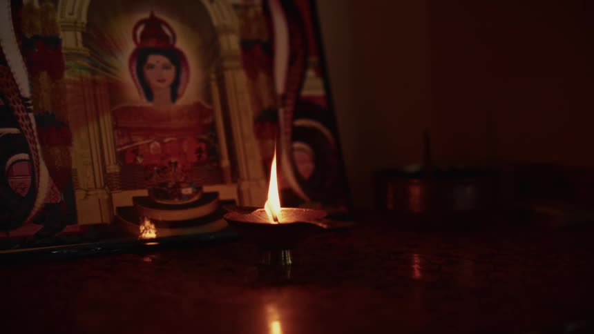 The candle is lit on the altar