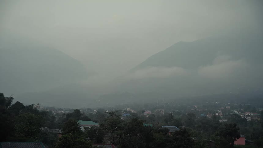 A view of clouds and storms over a rural community