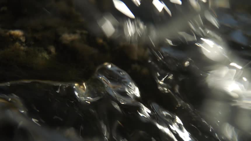 A view of a river flowing over some rocks